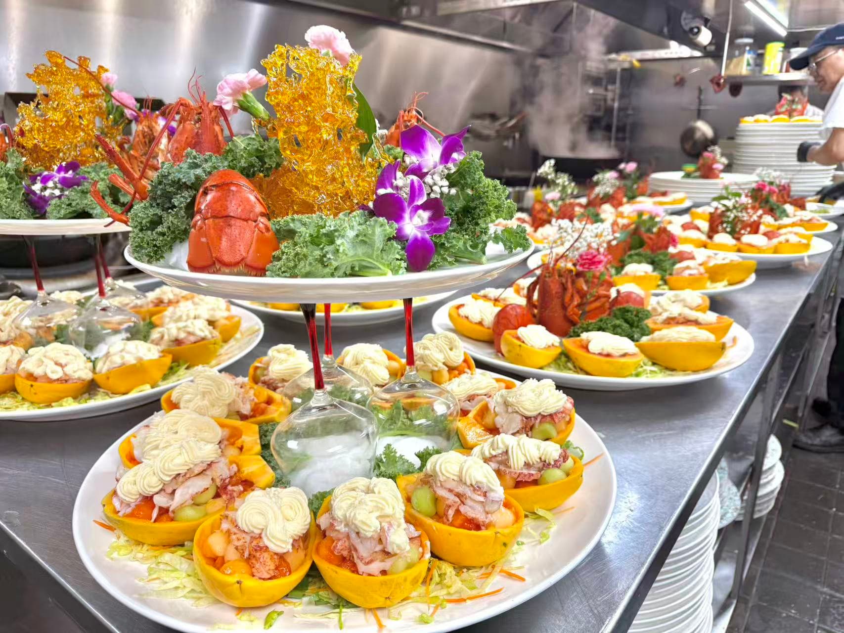 Lavish Cantonese seafood banquet platters being presented