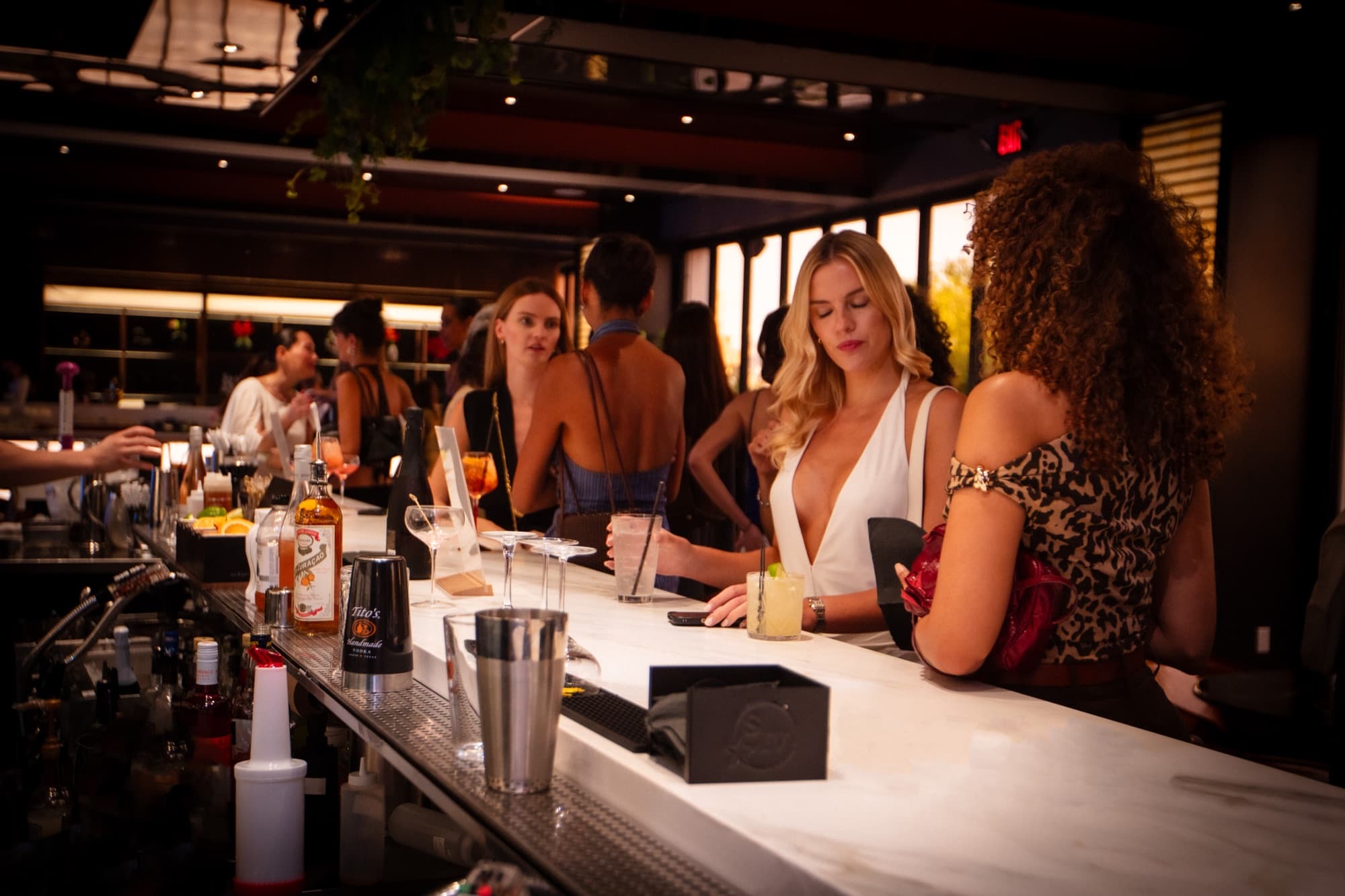 Cocktails going out across the bar counter