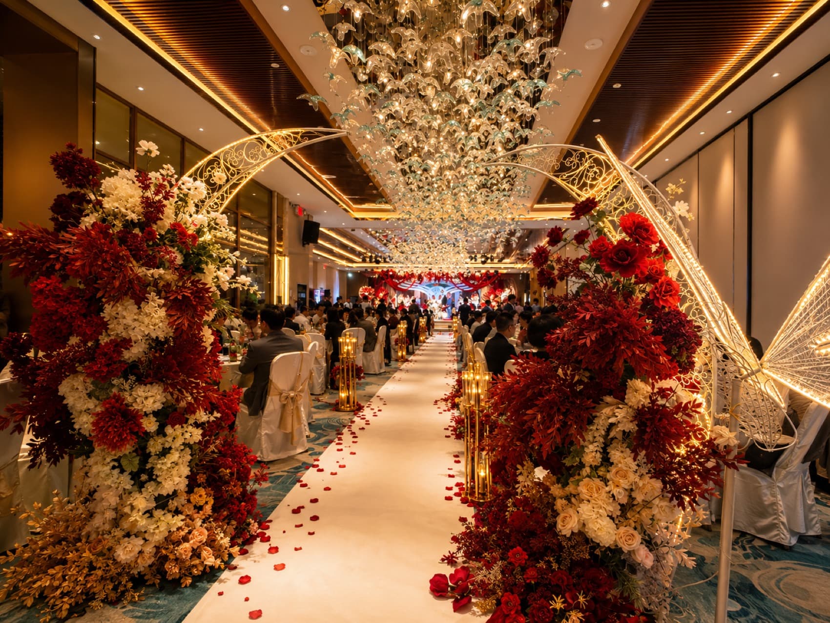 Floral aisle and banquet hall set for a birthday celebration