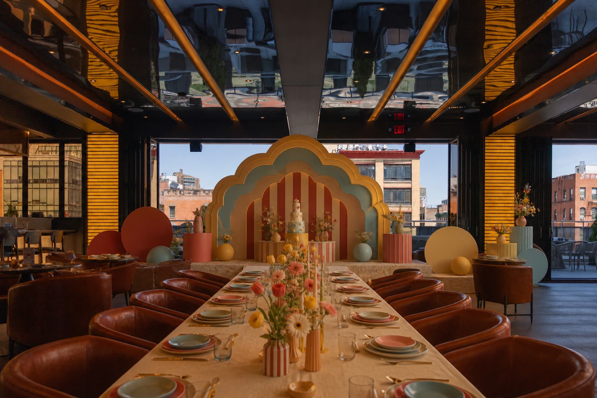 Retro pastel birthday tablescape in the lounge with city views