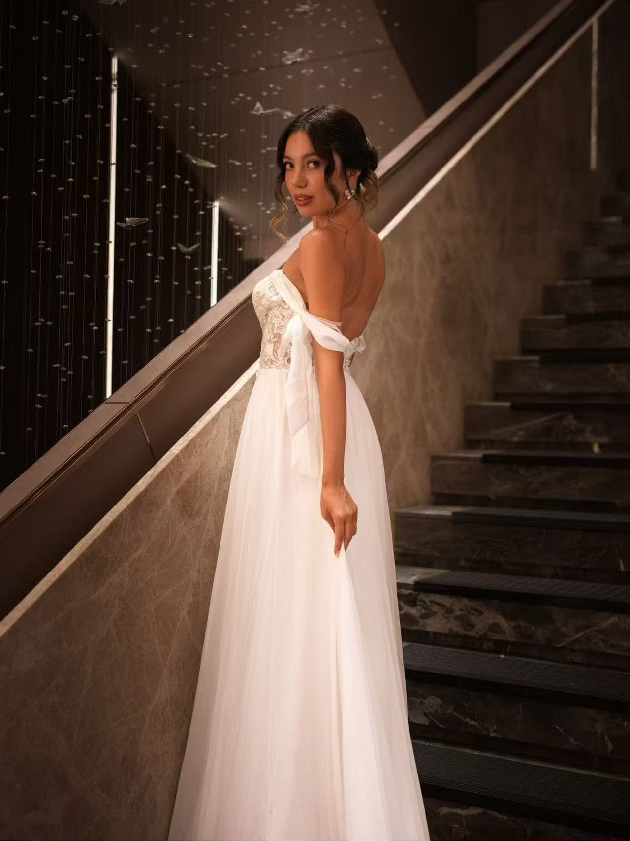 The back of a tulle bridal gown on the staircase