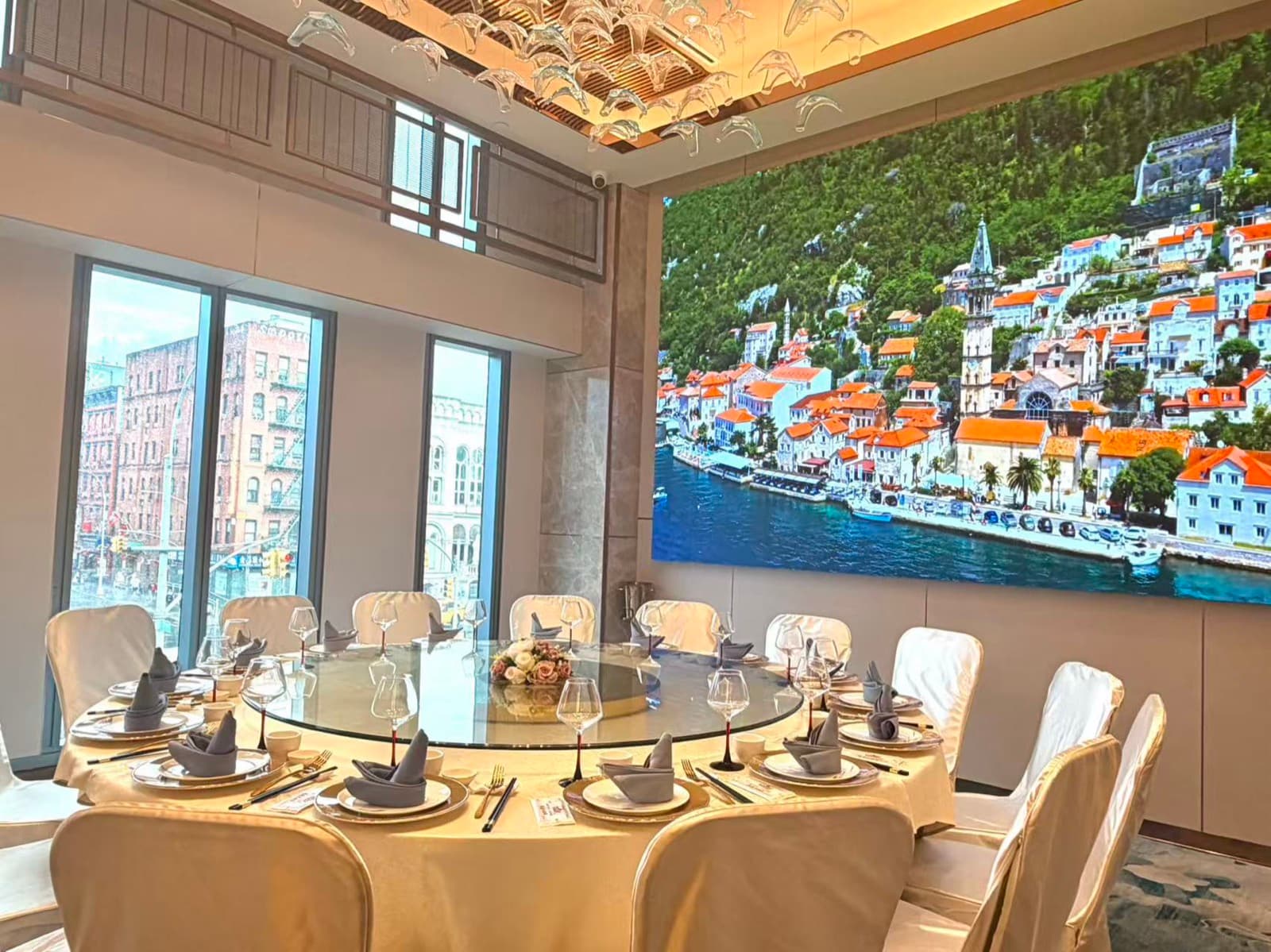 Private room with floor-to-ceiling windows and LED wall