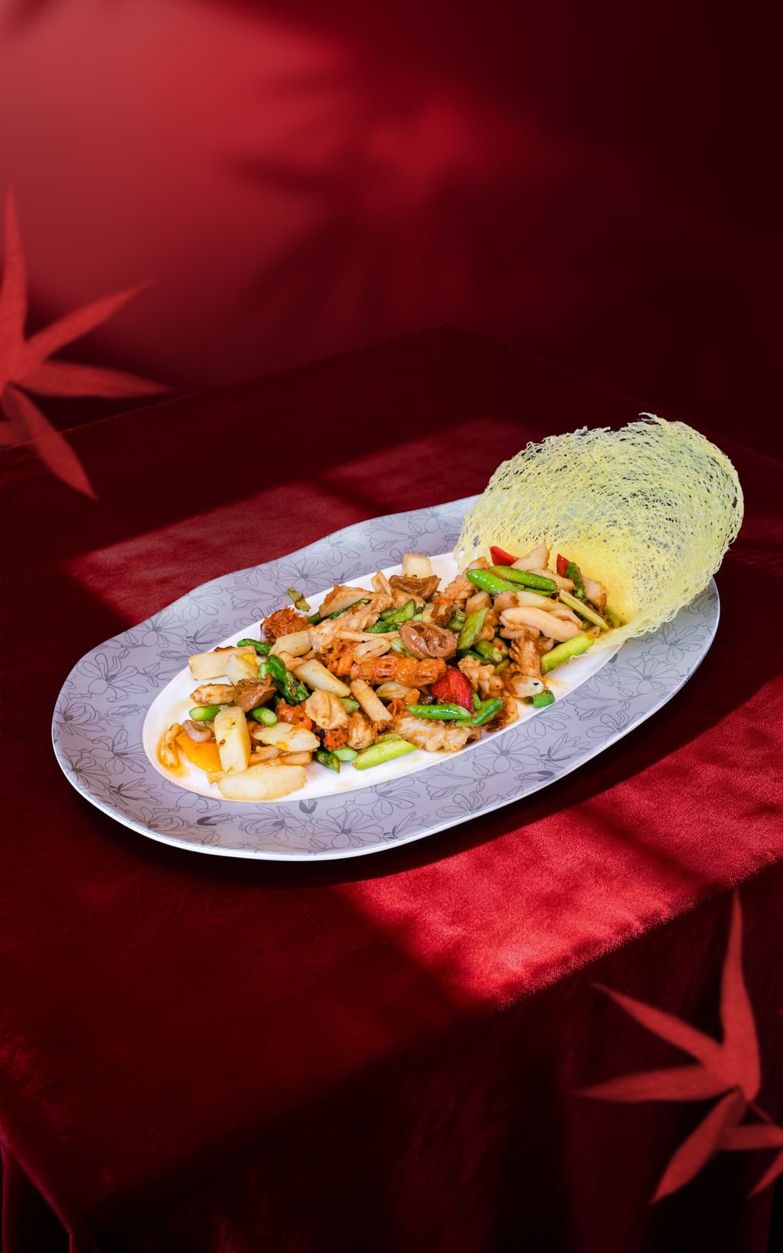 Stir-fried abalone with crispy noodle net