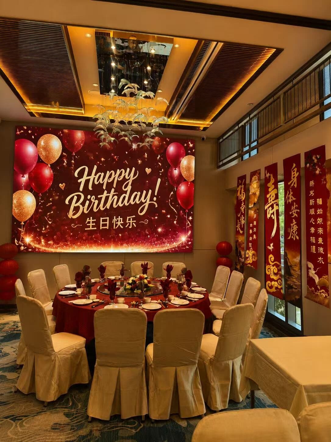 Private room with a custom birthday LED backdrop and balloon decor