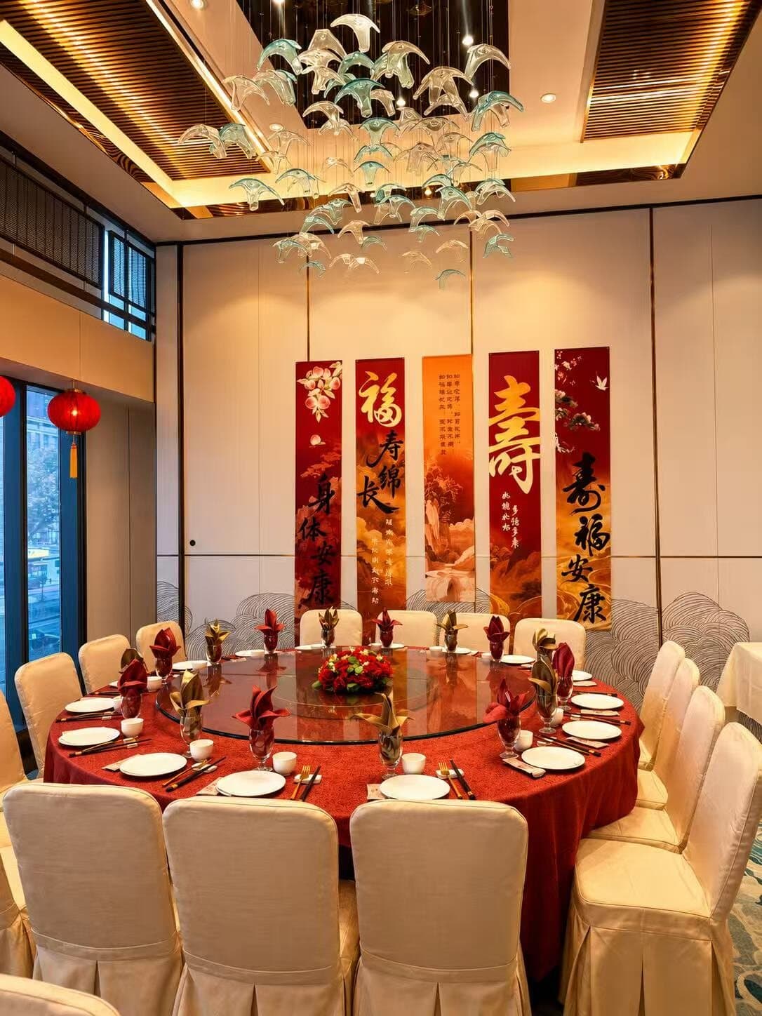 Private room set for a longevity banquet beneath calligraphy scrolls