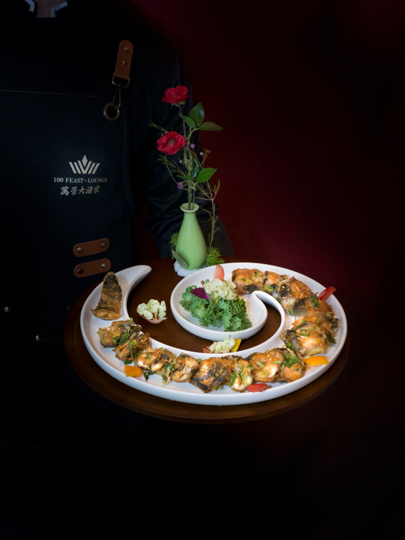 Server presenting a seafood platter