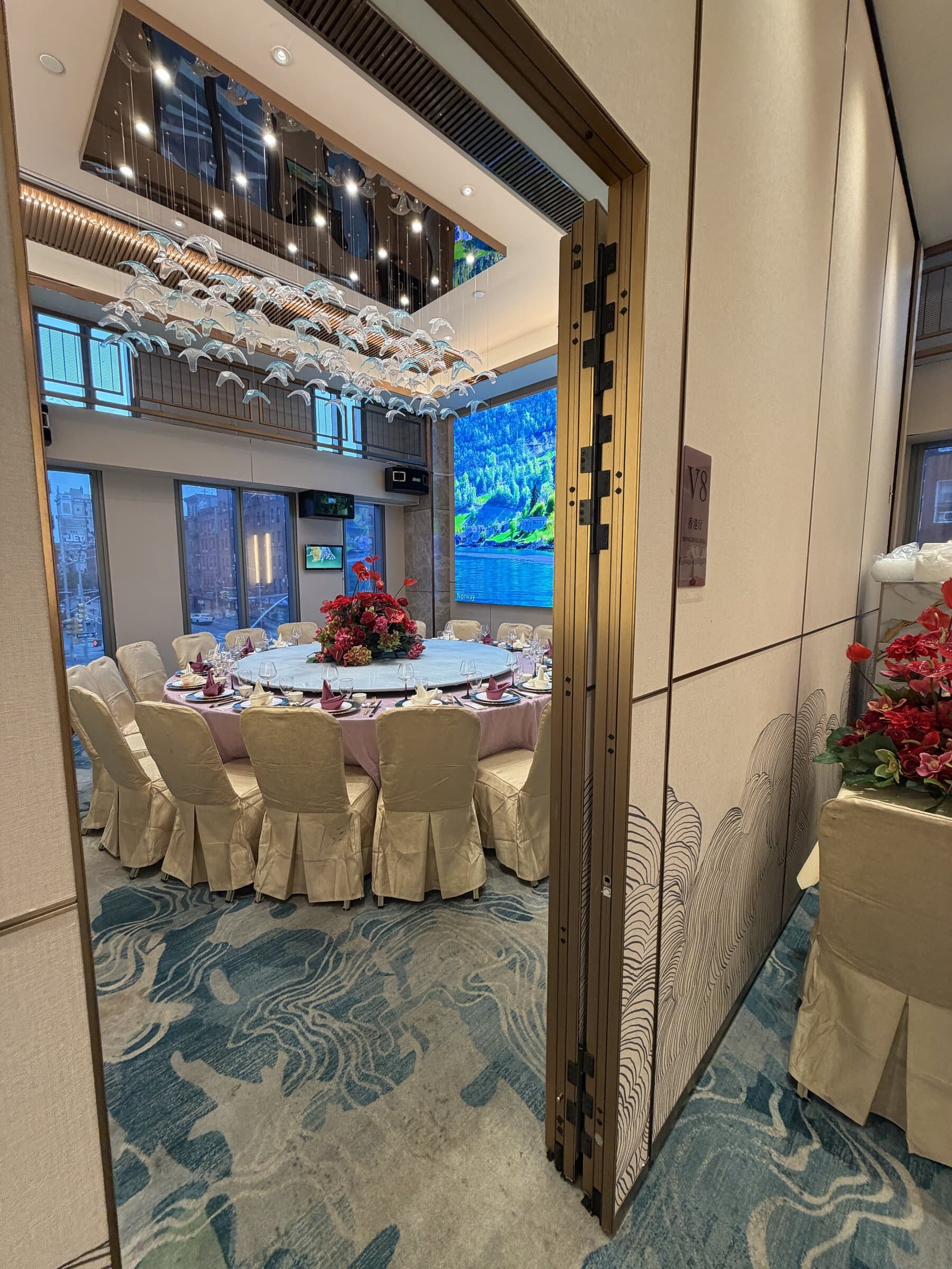 Gold-framed doorway looking into a private dining room