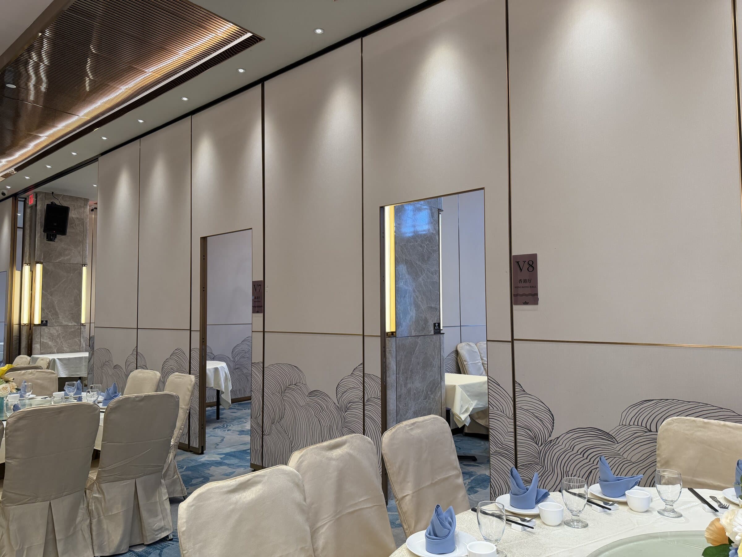 Movable partition wall dividing the banquet floor into numbered private rooms