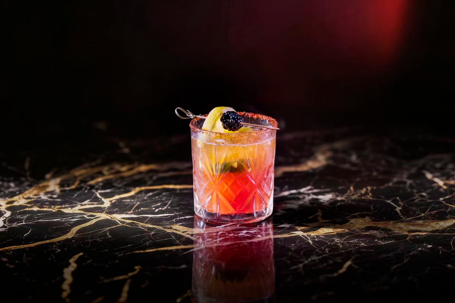 Old Fashioned served on gold-veined marble