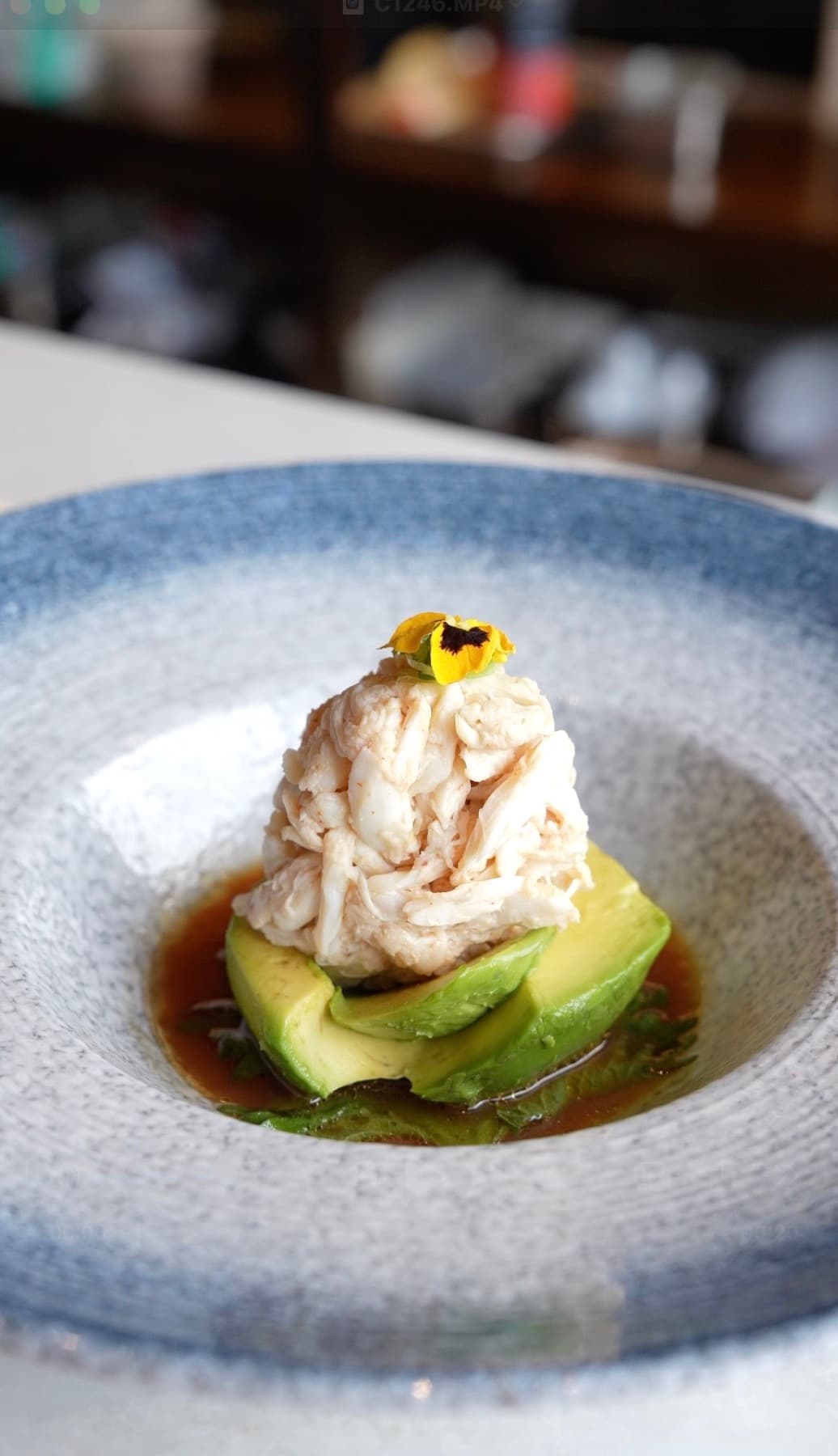 Chilled crab stacked over avocado